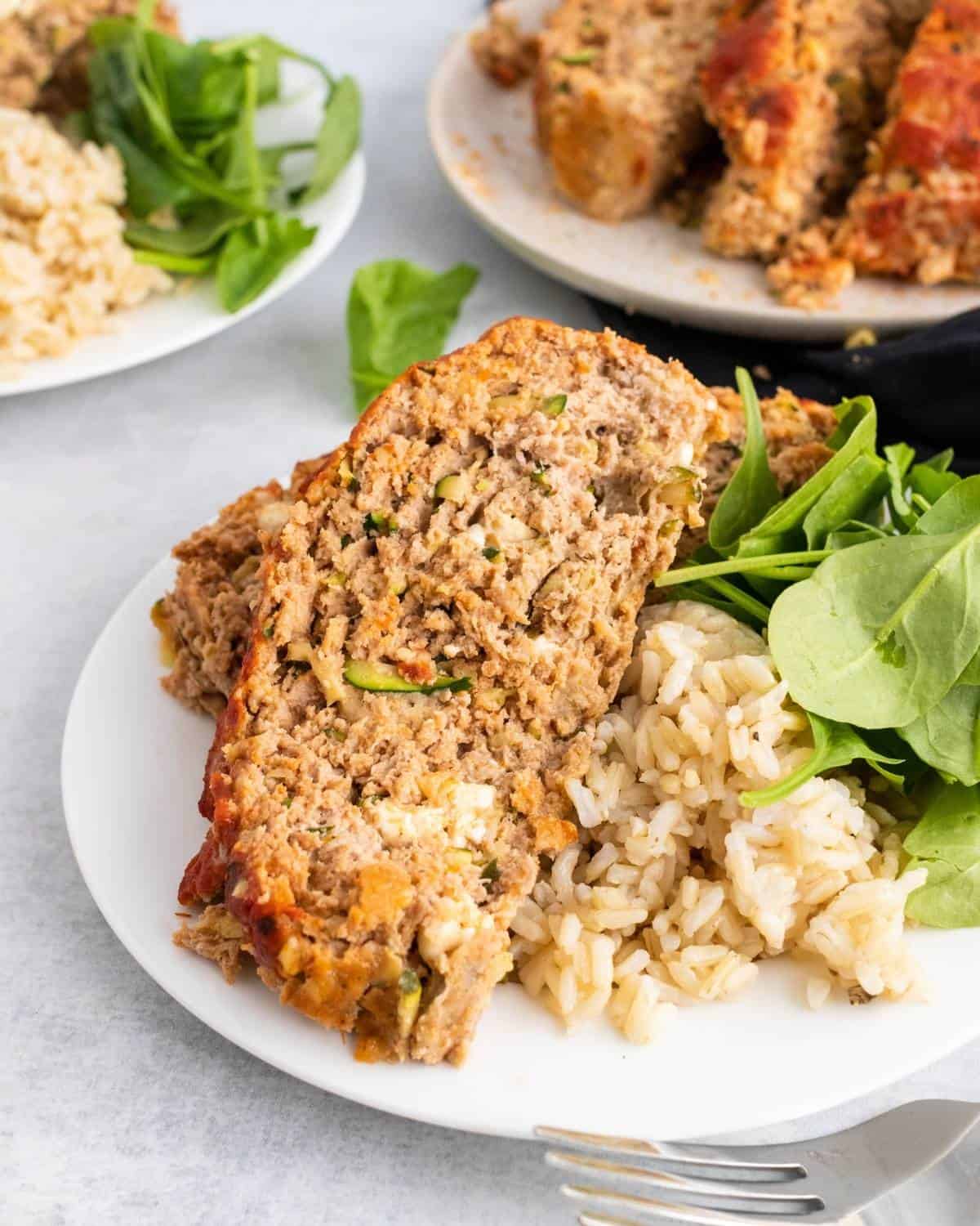 slices of turkey meatloaf with shredded zucchini and feta cheese