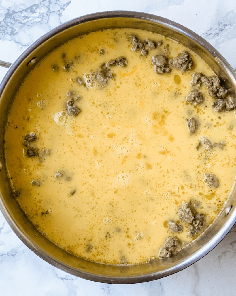 Eggs poured in with the sausage.