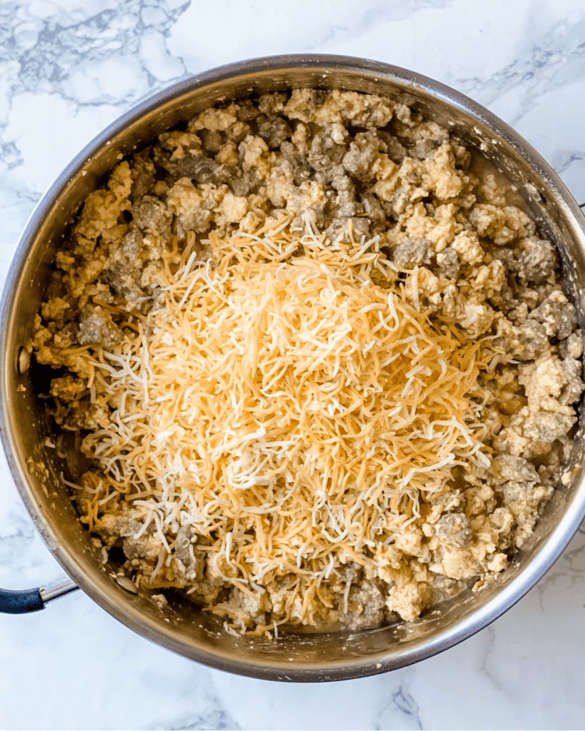 shredded cheese on egg mixture.