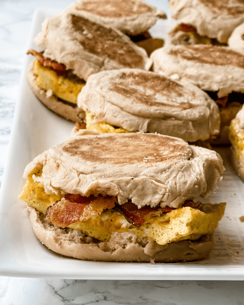 put together egg bacon sandwiches on a platter
