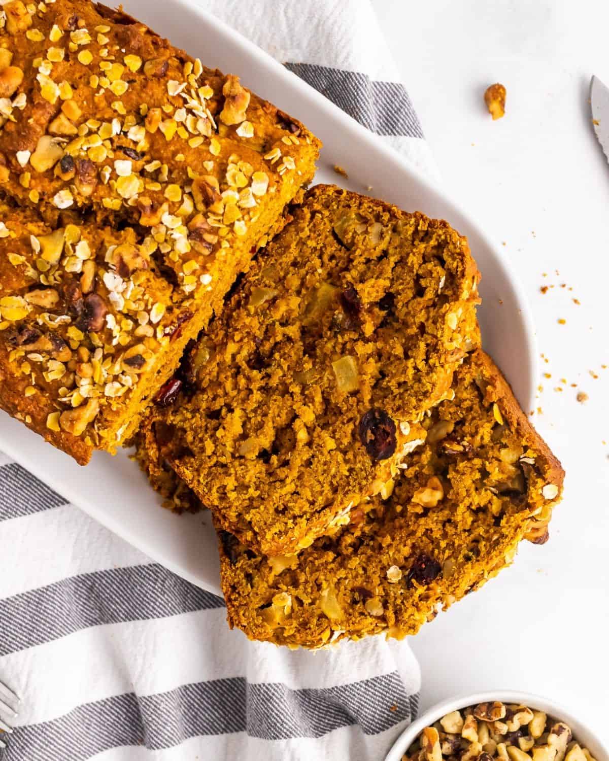 overhead picture of sliced apple pumpkin bread on a plate