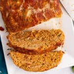 Mexican meatloaf slices on white plate