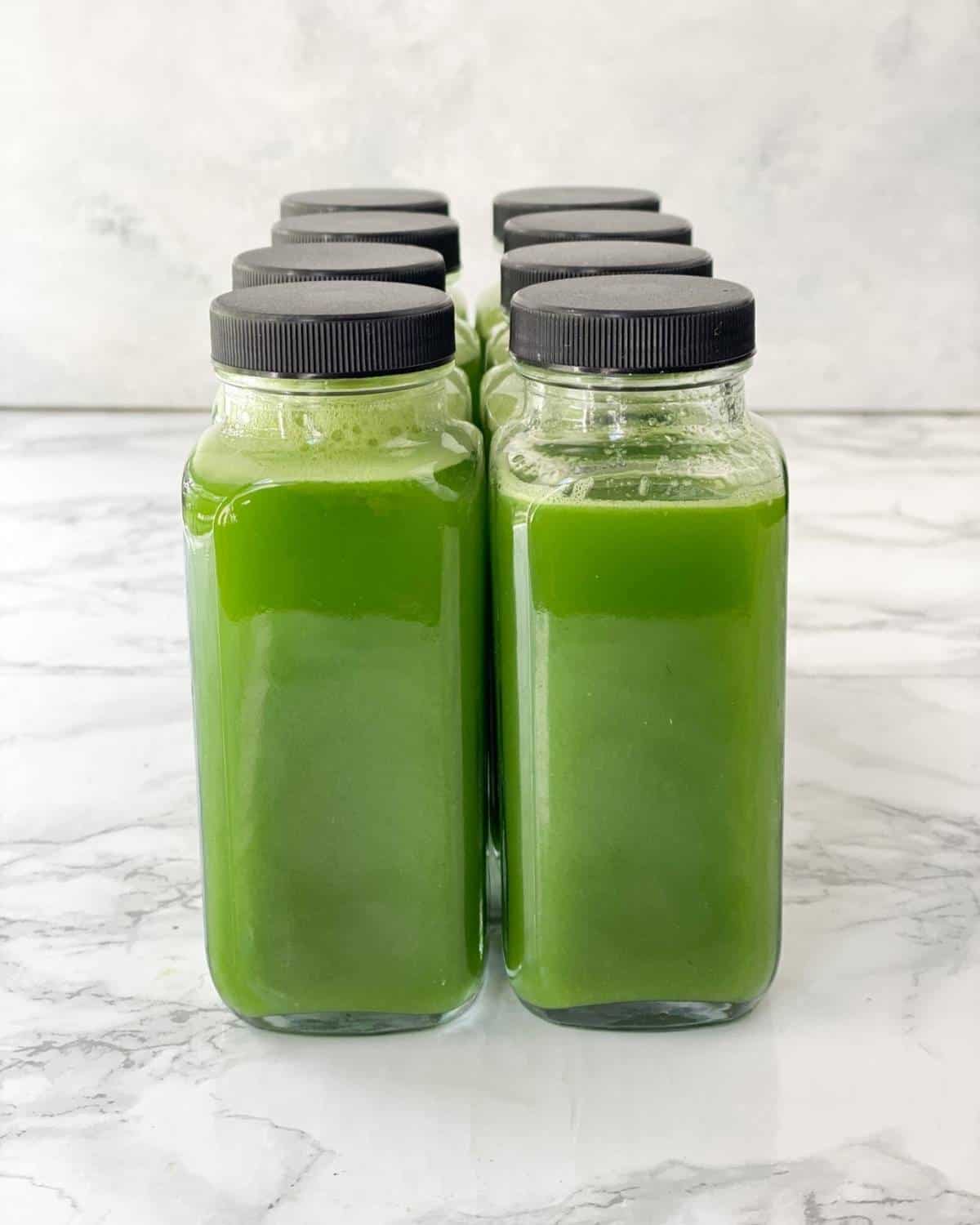 vitamix green juice in glass containers.