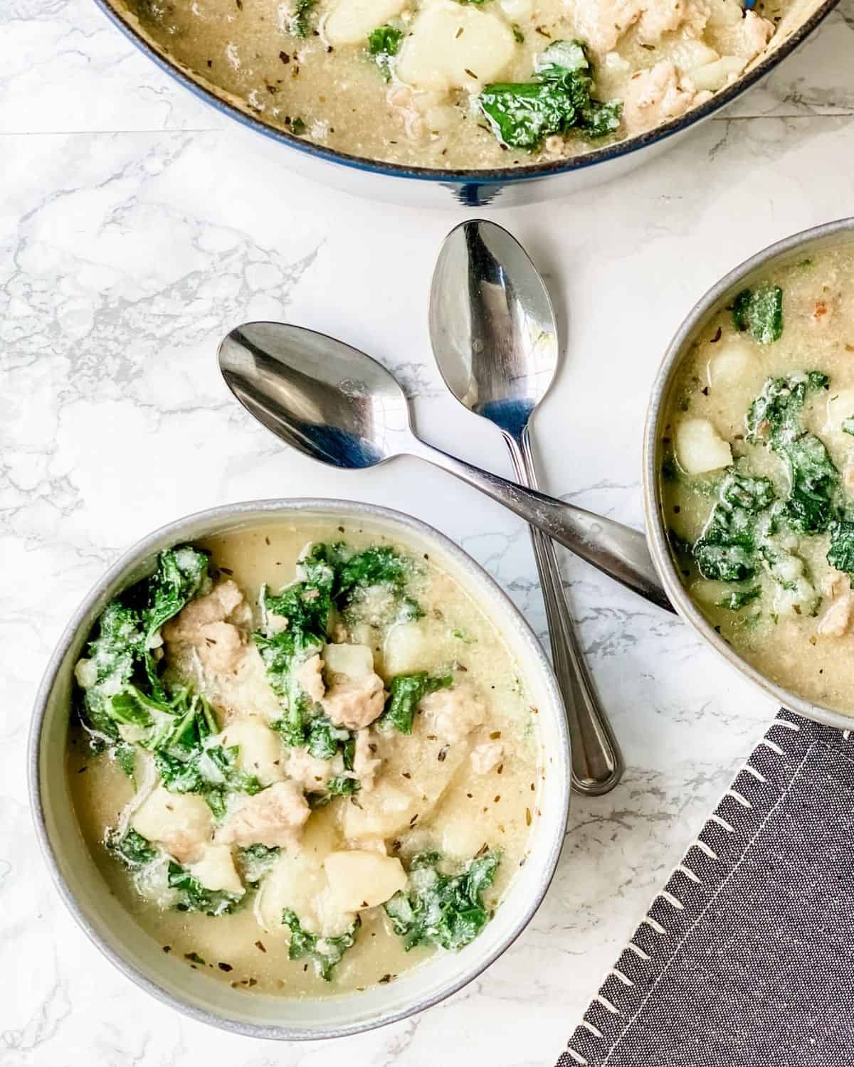 overhead view of two bowls of Zuppa Toscana 