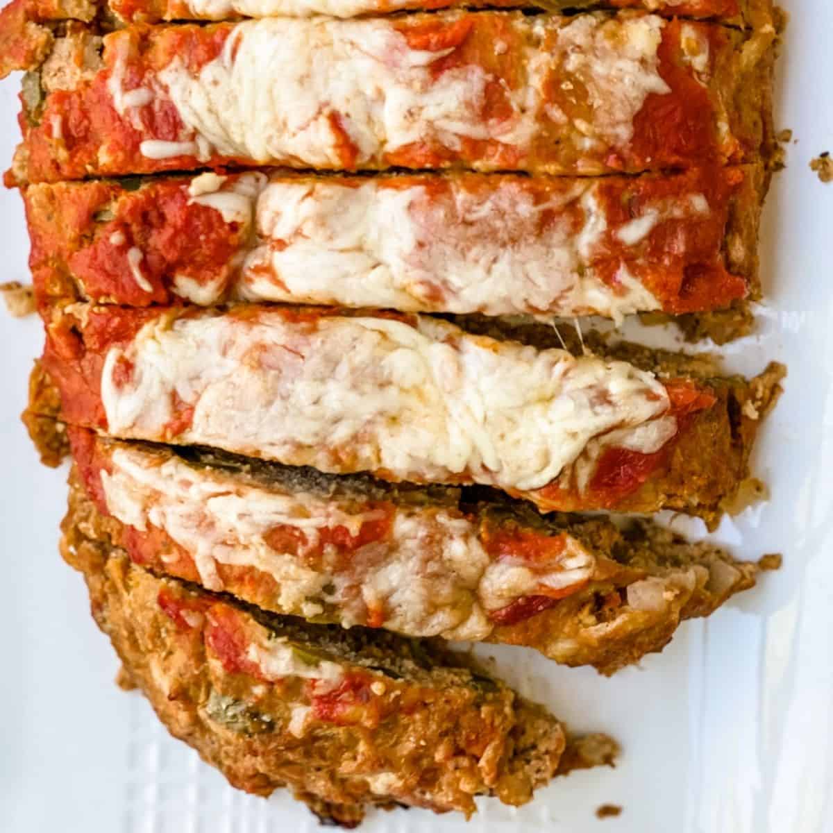 overhead picture of the sagas meatloaf with melted cheese on top.