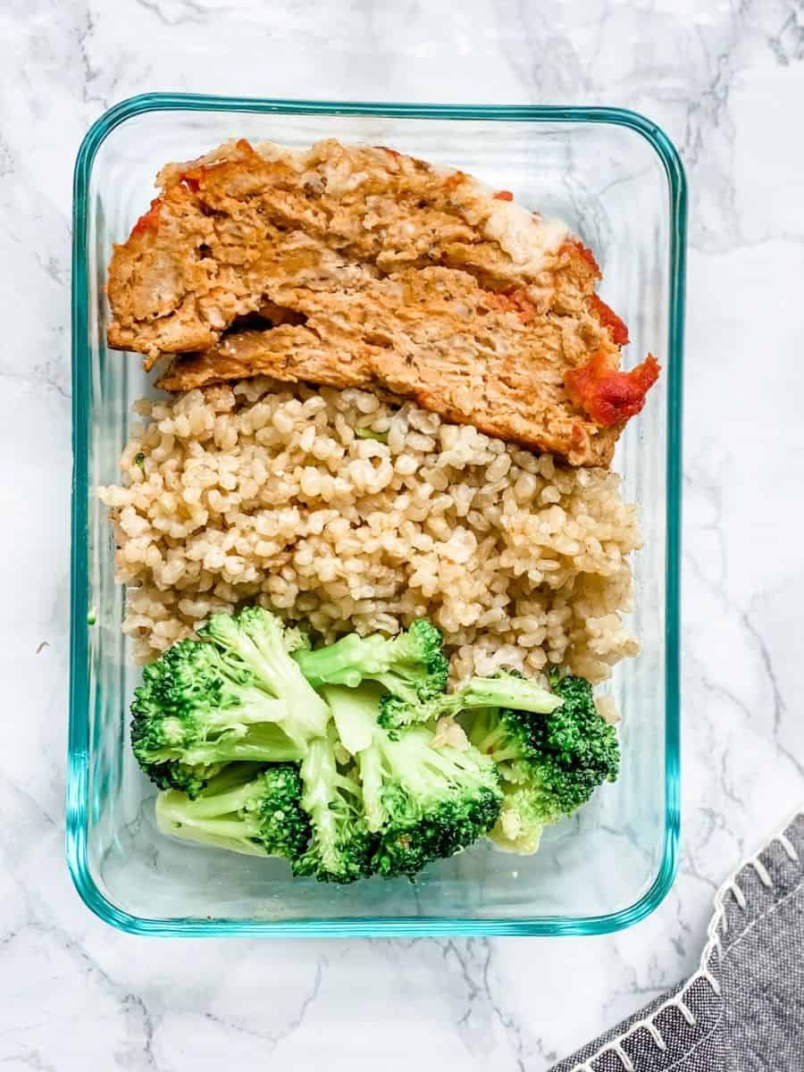 meatloaf rice and broccoli in a glass meal prep container