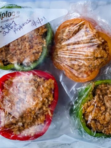 Can you freeze stuffed peppers? Yes, you can! This tutorial will share the different methods and answer all your questions for freezing stuffed peppers to make it easier to have a clean eating healthy dinner at a moment's notice.