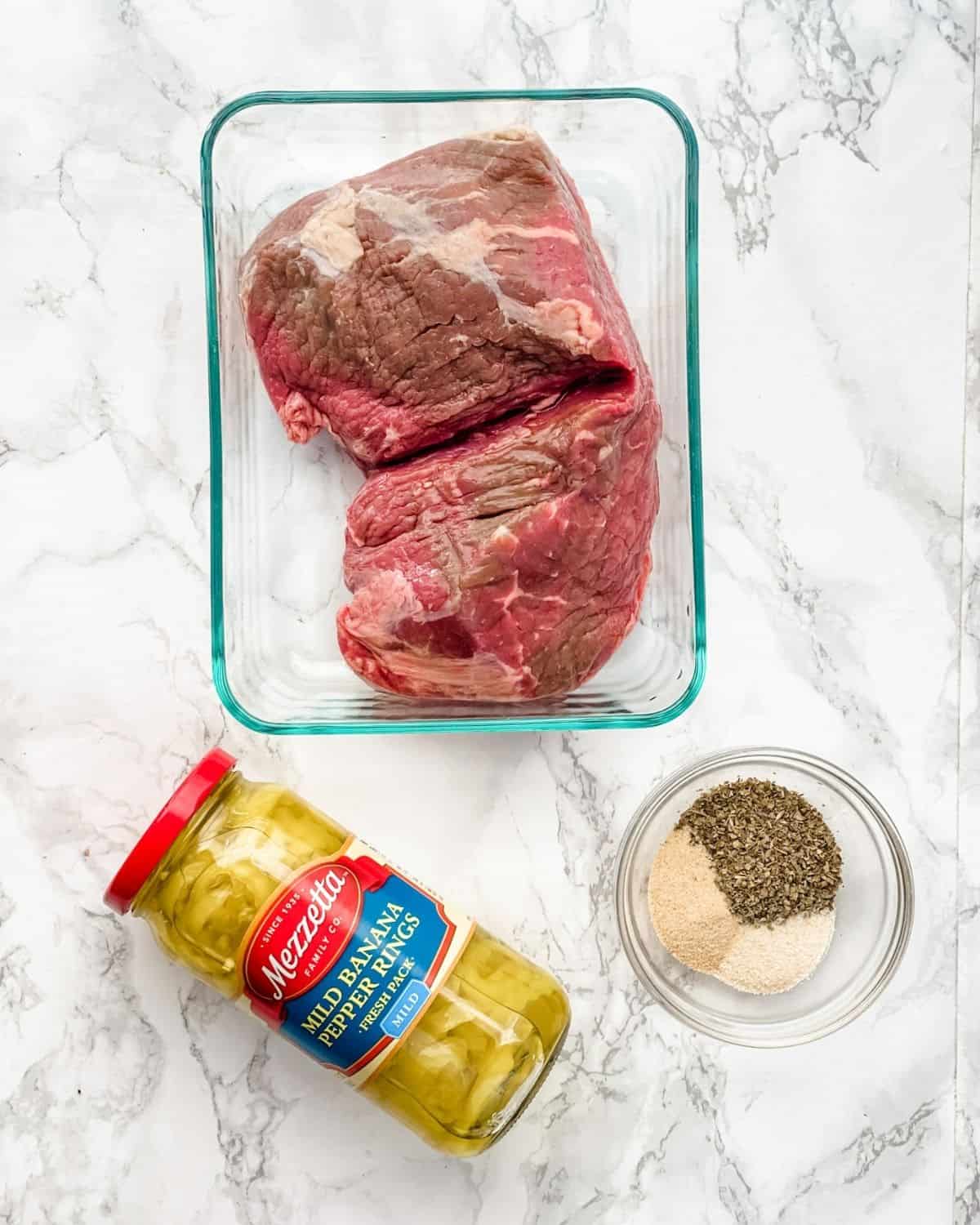 the ingredients to makes slow cooker italian beef. 