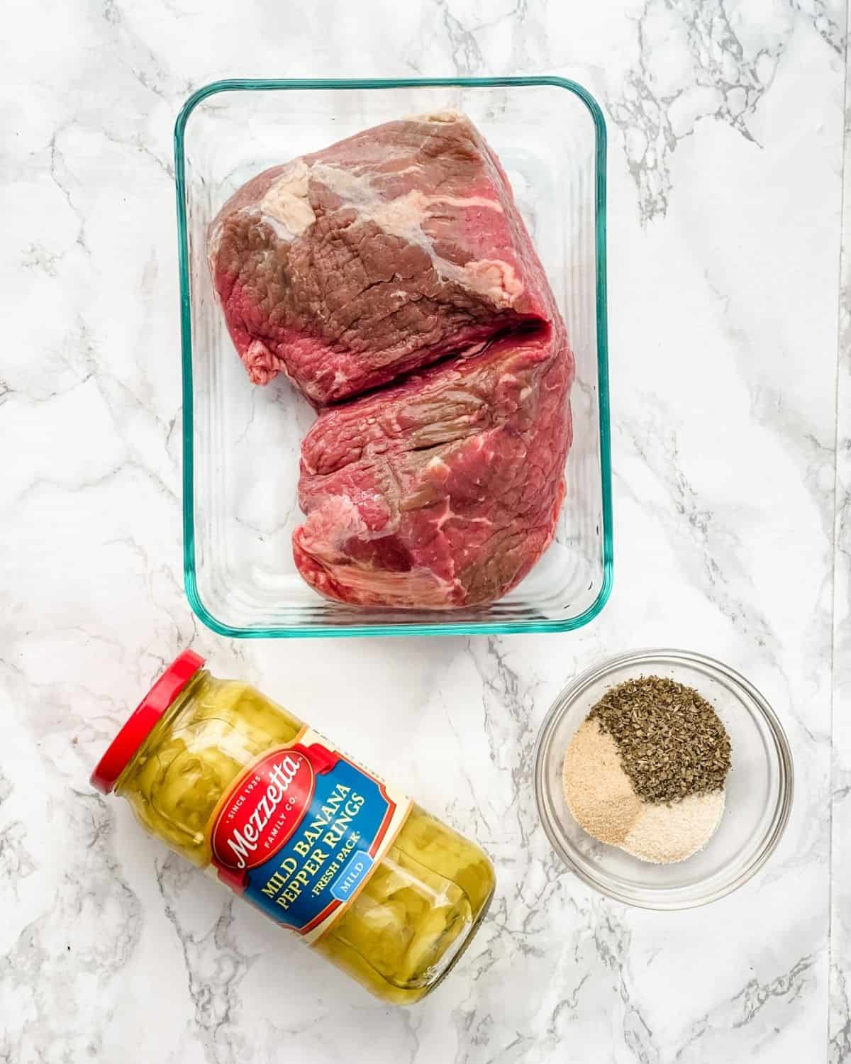 the ingredients to makes slow cooker italian beef.