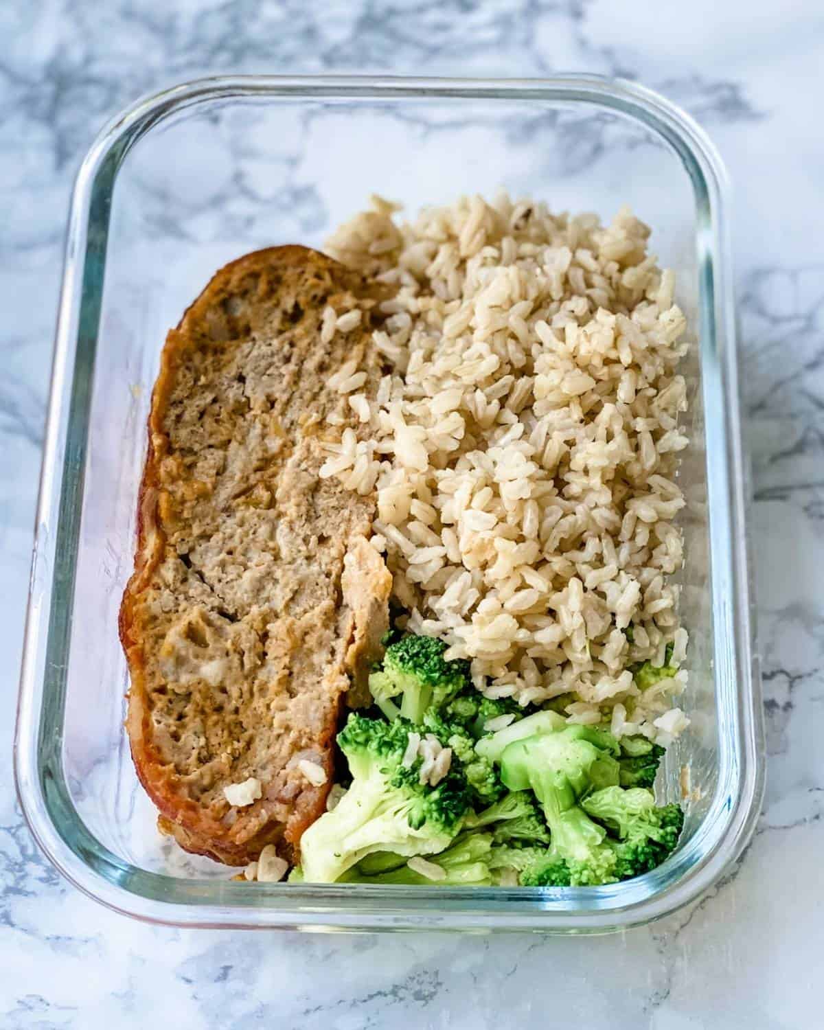 meal prep glass container with meatloaf rice and broccoli 