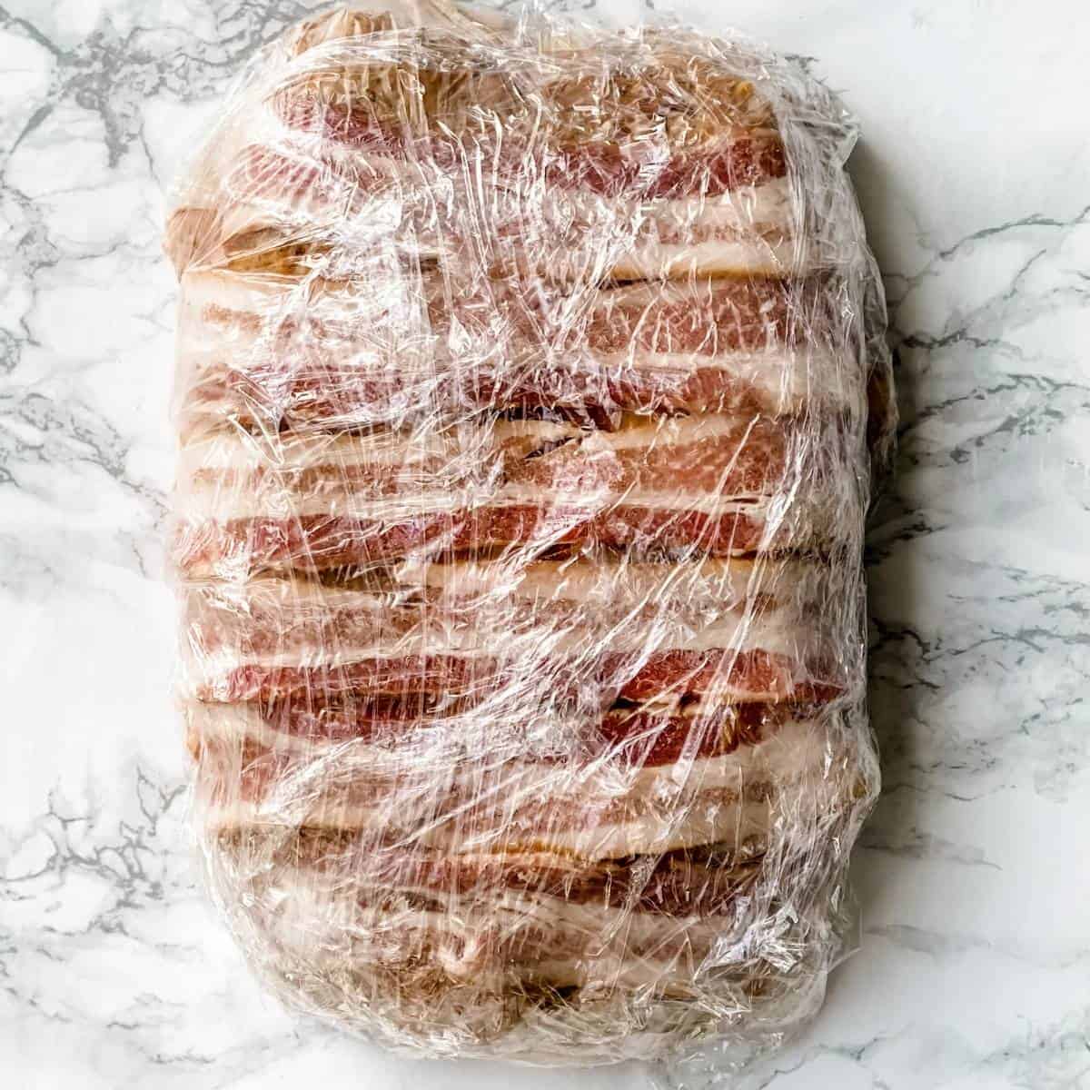 Meatloaf wrapped in plastic wrap