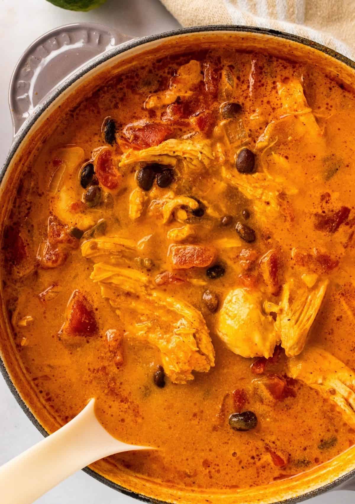 Overhead photo of soup pot with chicken enchilada soup