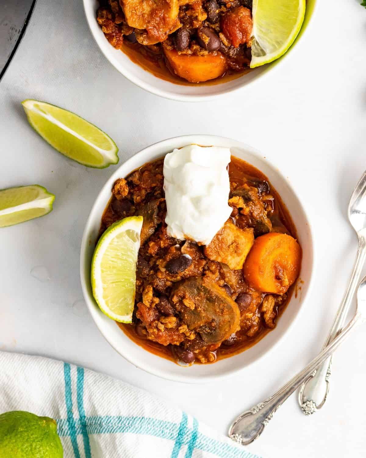 overhead picture of the turkey veggie chili with chunks of carrots and mushrooms.