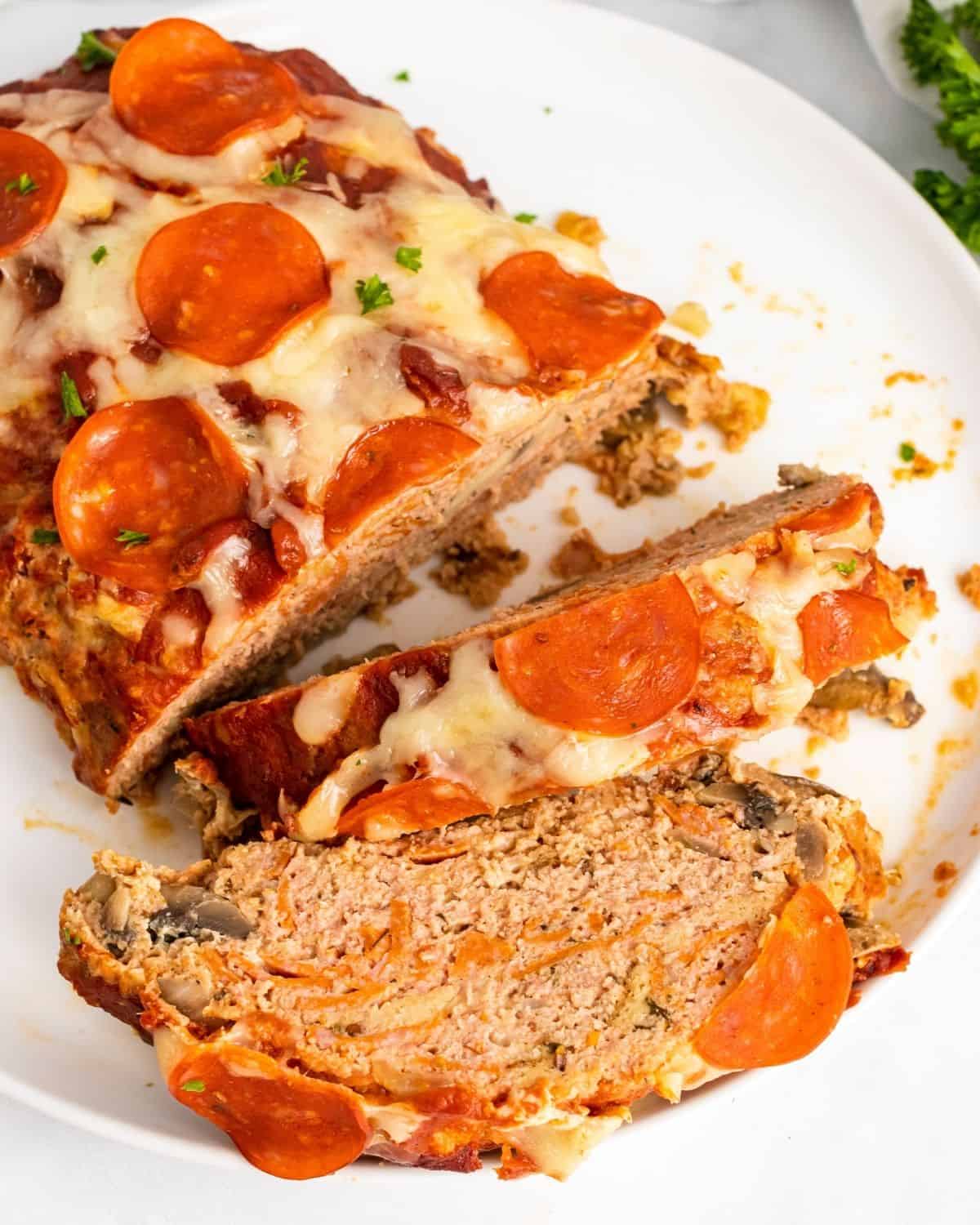 pizza meatloaf sliced on a platter