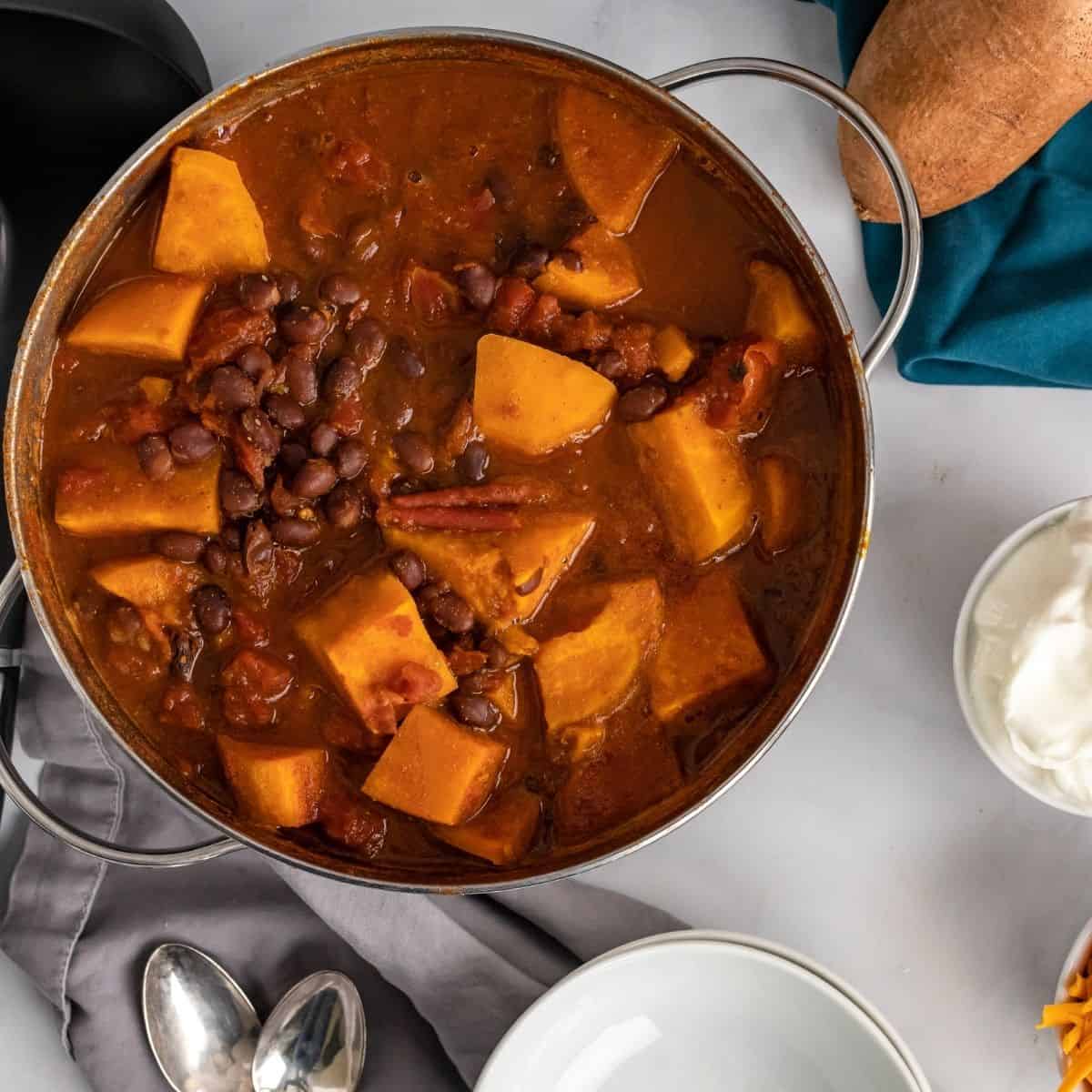 Overhead picture of sweet potato black bean chili in a soup pot.