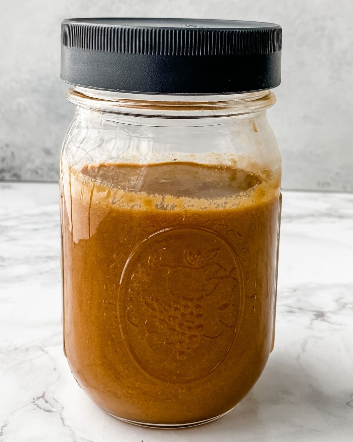 Thai peanut sauce in a mason jar with the lid on