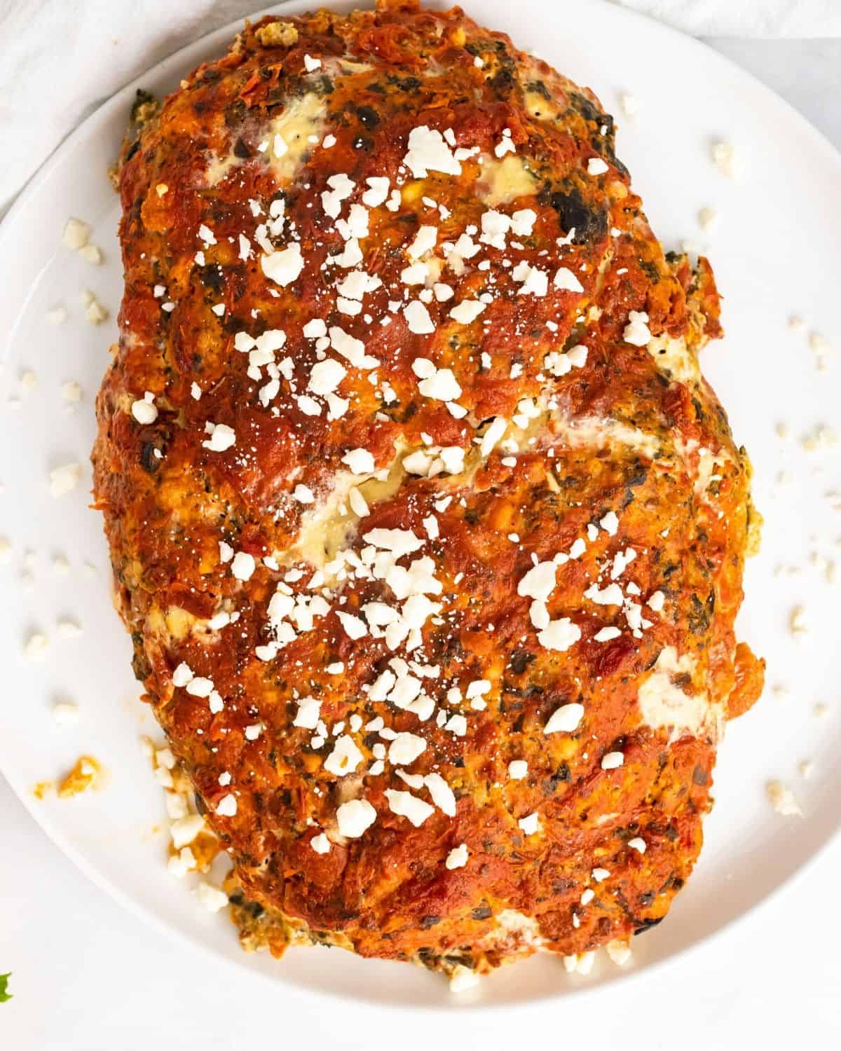 greek meatloaf on a platter