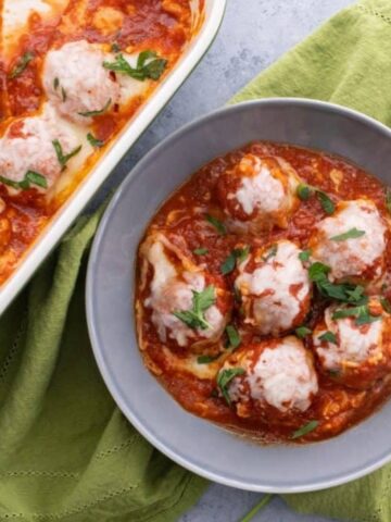 chicken parmesan meatballs in a bowl and next to a pan