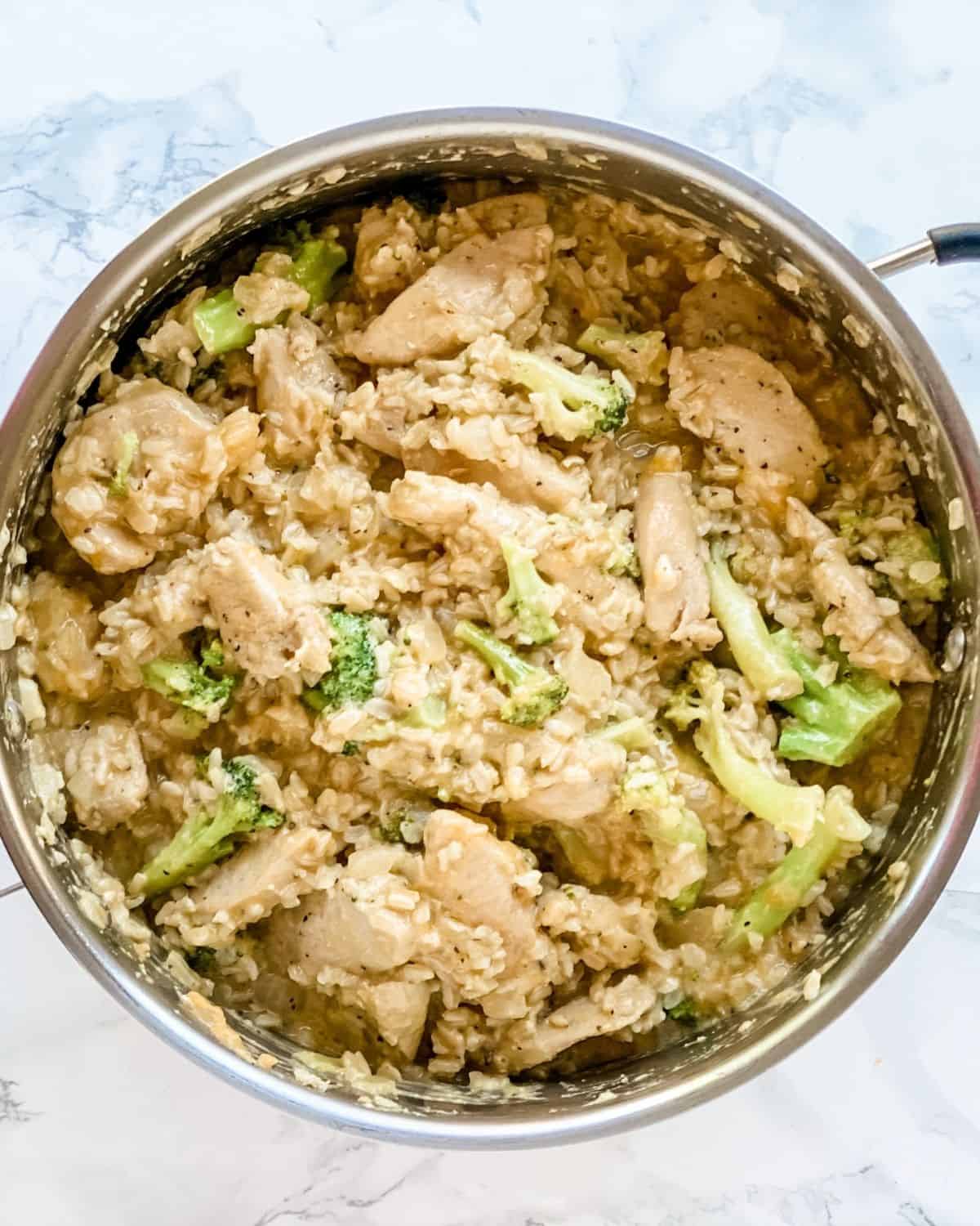 overhead picture of chicken and rice in a pot.