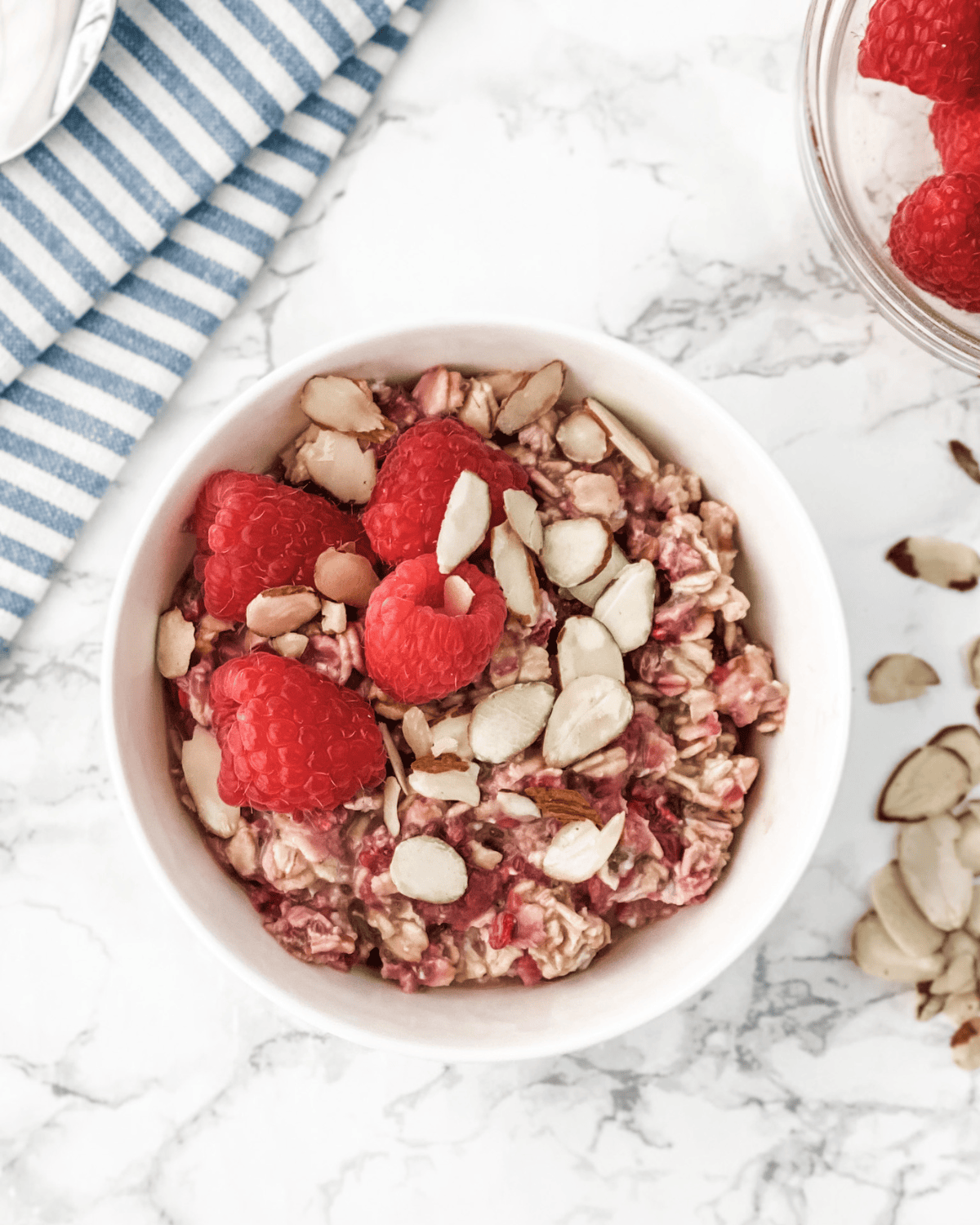 raspberry overnight oats in a bow with almonds