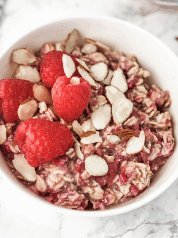 raspberry overnight oats in a white bowl