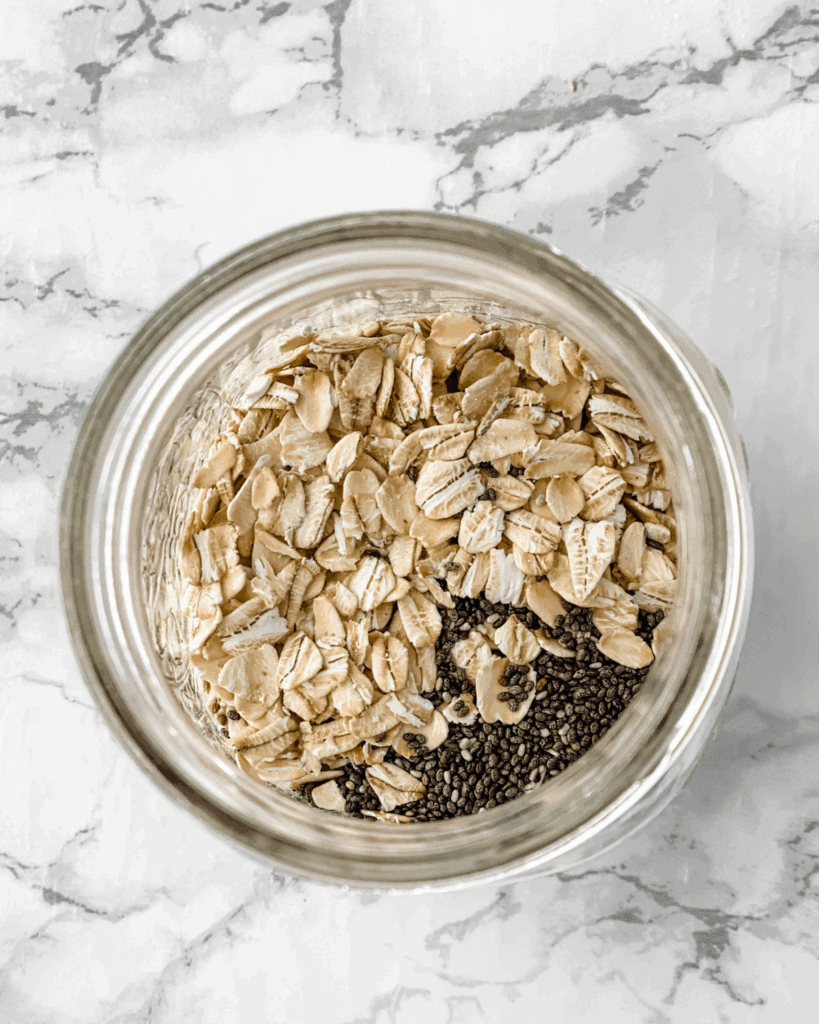 rolled oats and chia seeds in a glass mason jar