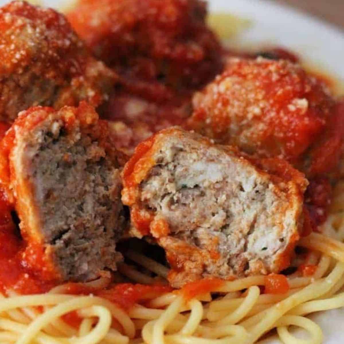 turkey meatballs on a plate with pasta.