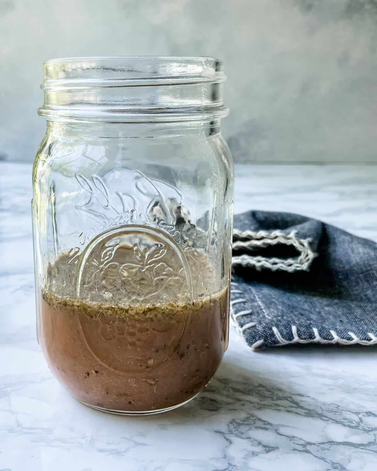 greek dressing mixed in a mason jar.