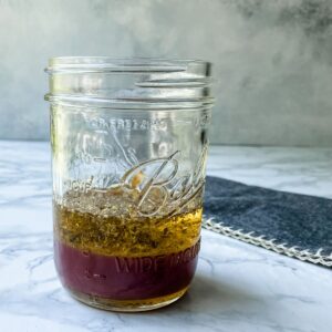 Greek Vinaigrette in a mason jar.