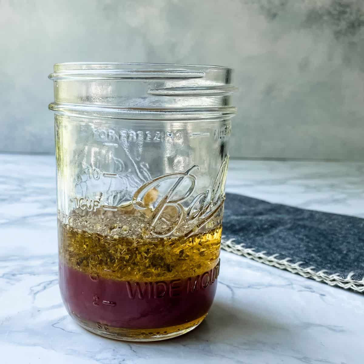 greek vinaigrette in a mason jar.