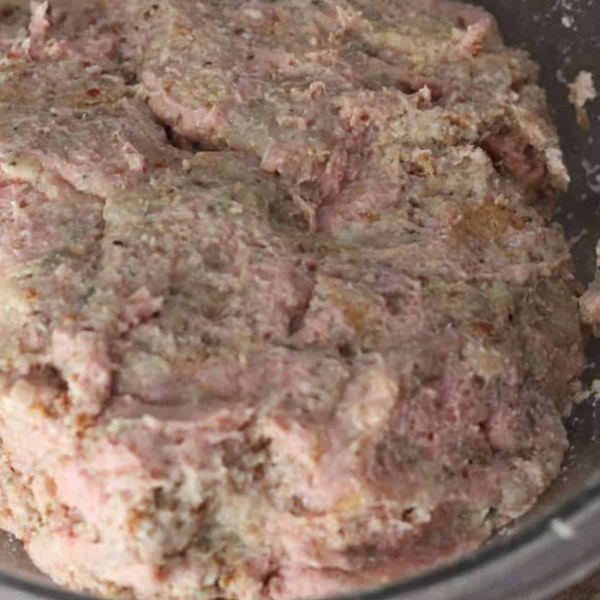 close-up picture of turkey meatball mixture in a glass bowl.