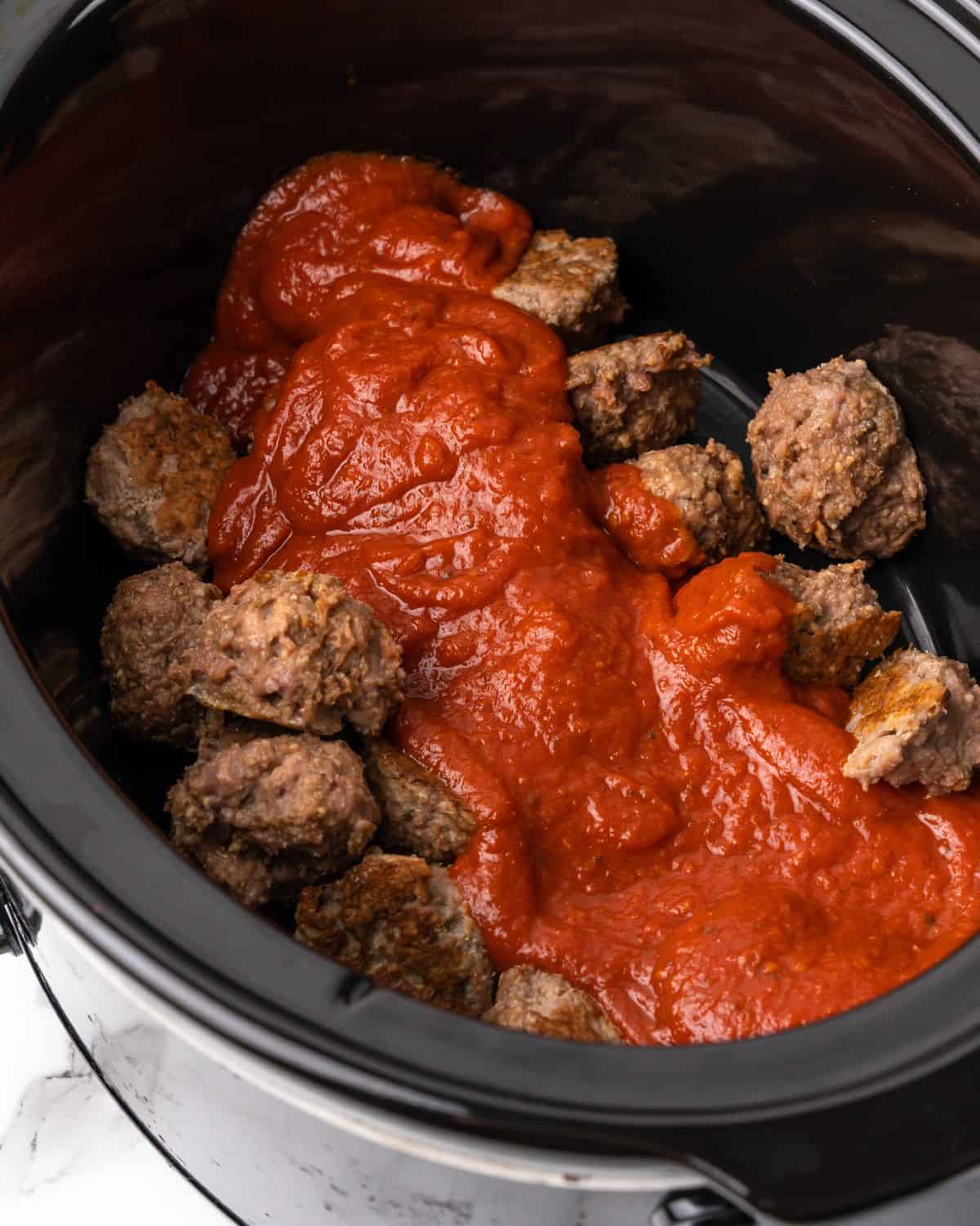meatballs and sauce in the slow cooker.