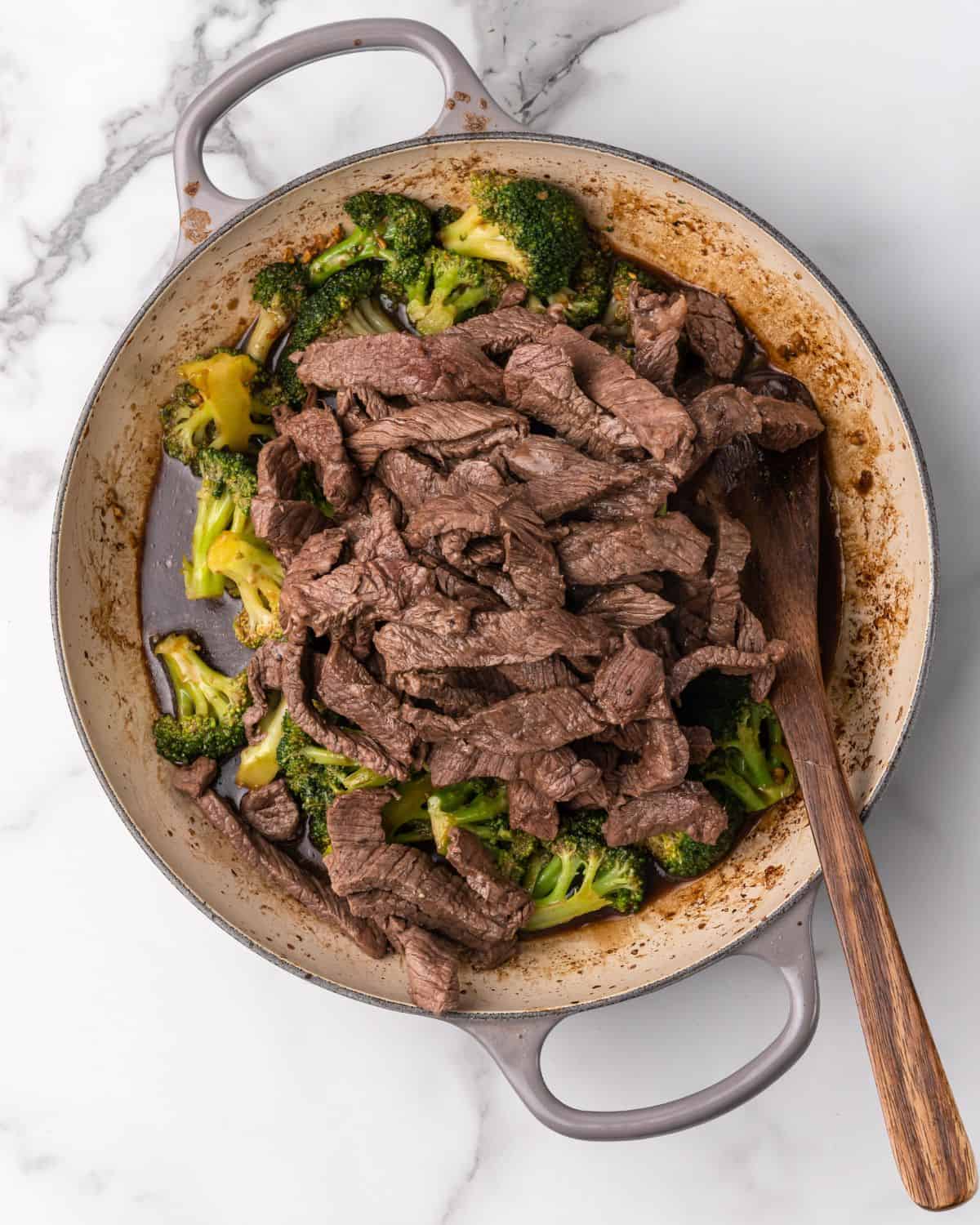 the steak strips added in with sauce and broccoli.