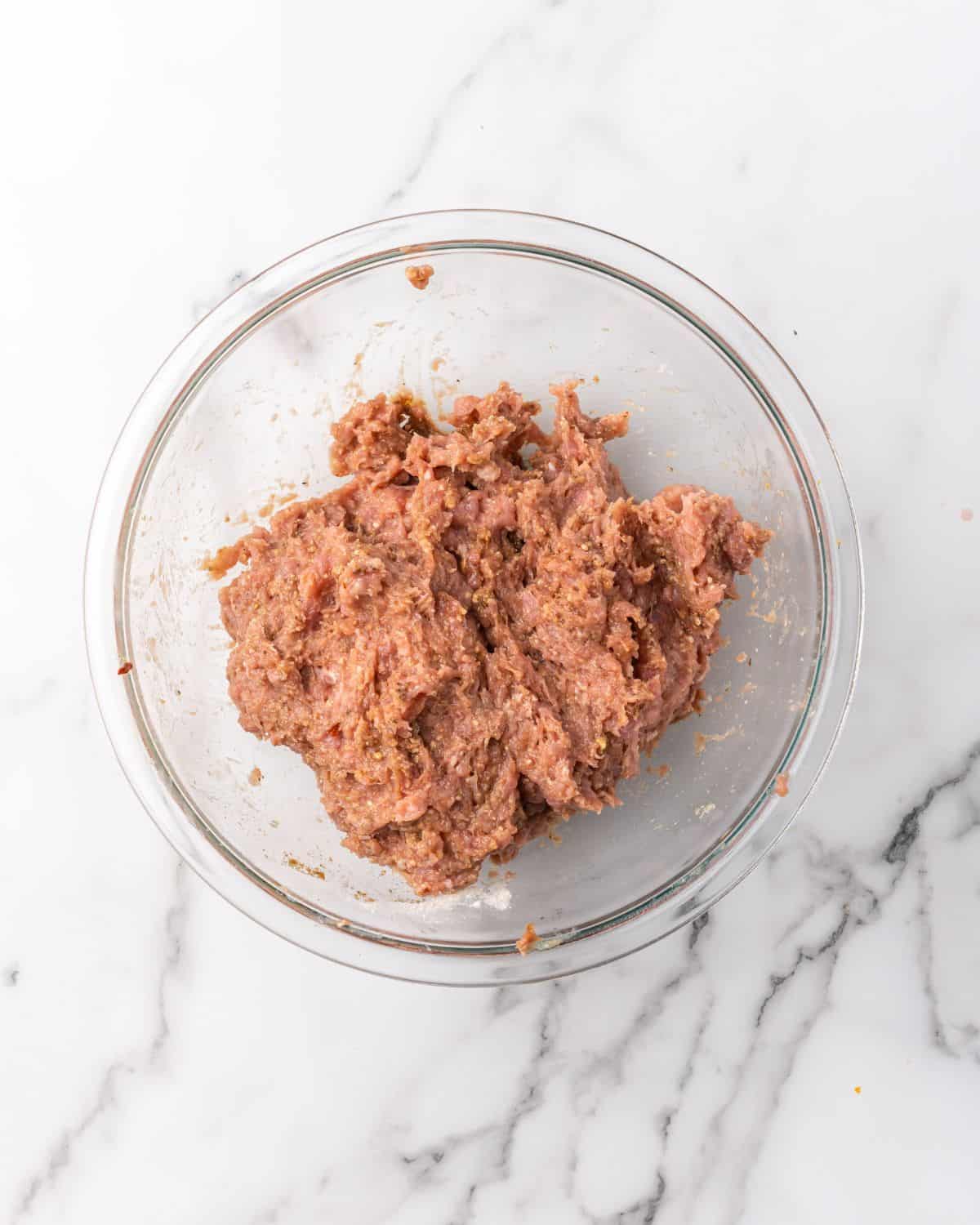 ground turkey meatball ingredients mixed in a bowl.