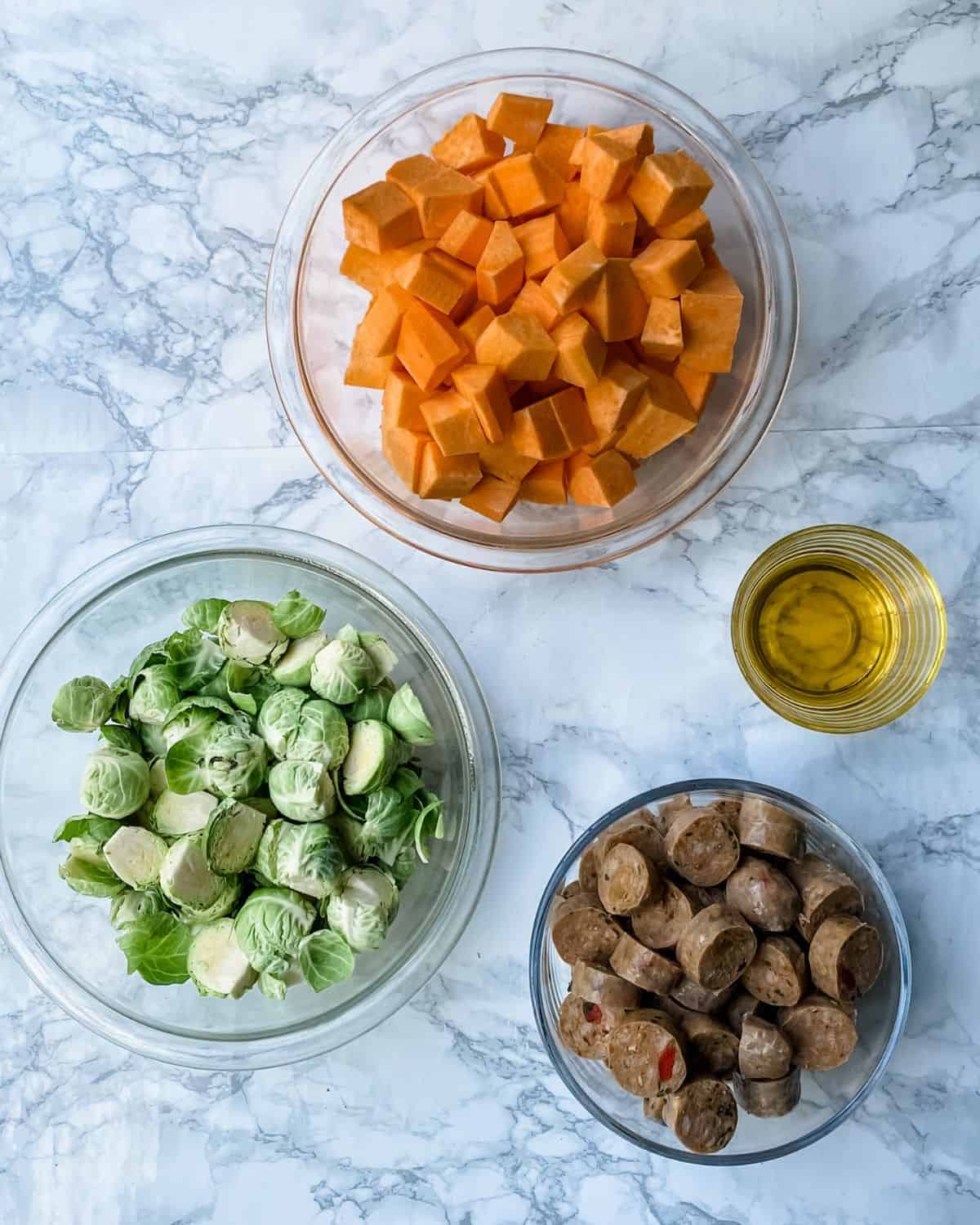 Ingredients to make sheet pan sausage and veggies recipe.