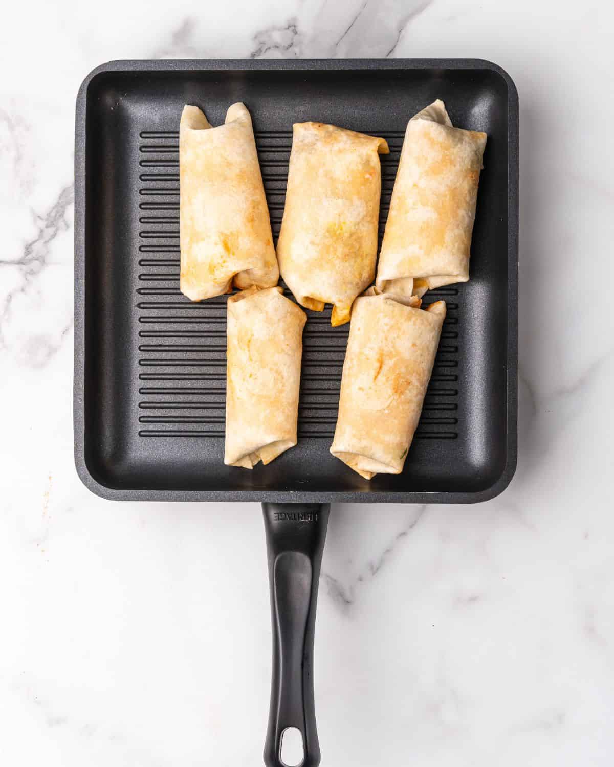 grilling the wraps seem sids down on an indoor grill pan.