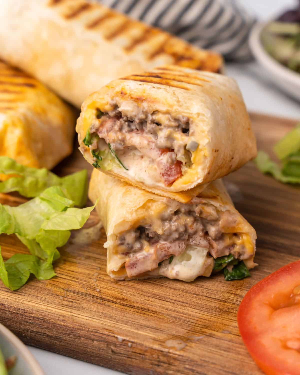 close up picture of burger wrap cut in half.