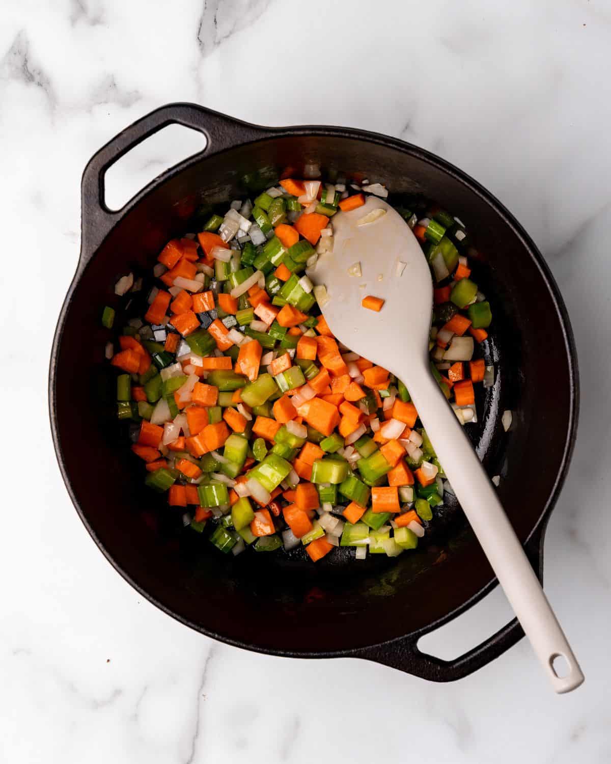 carrots, celery, onions cooked in a soup pot