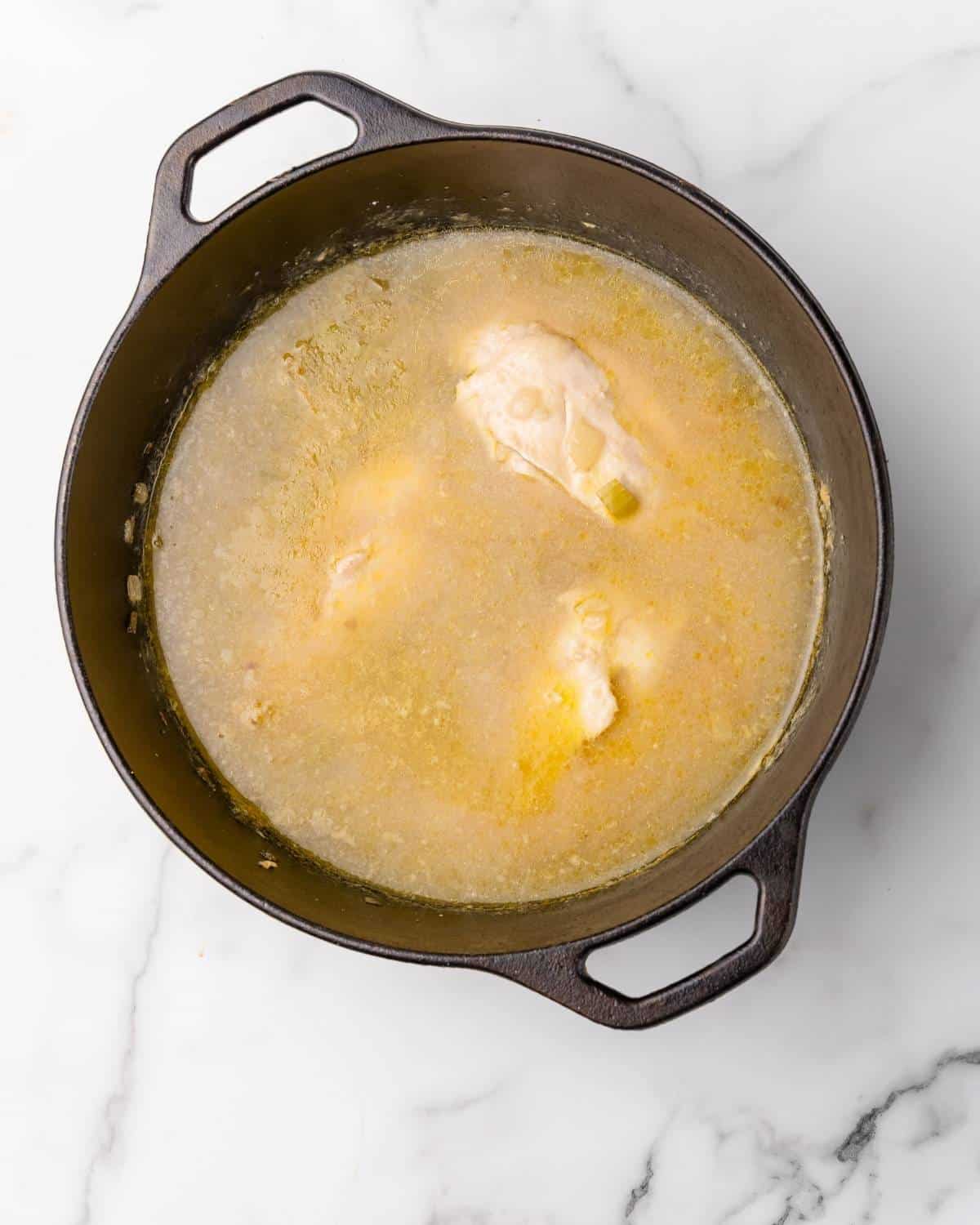 chicken cooked in the pot with the broth