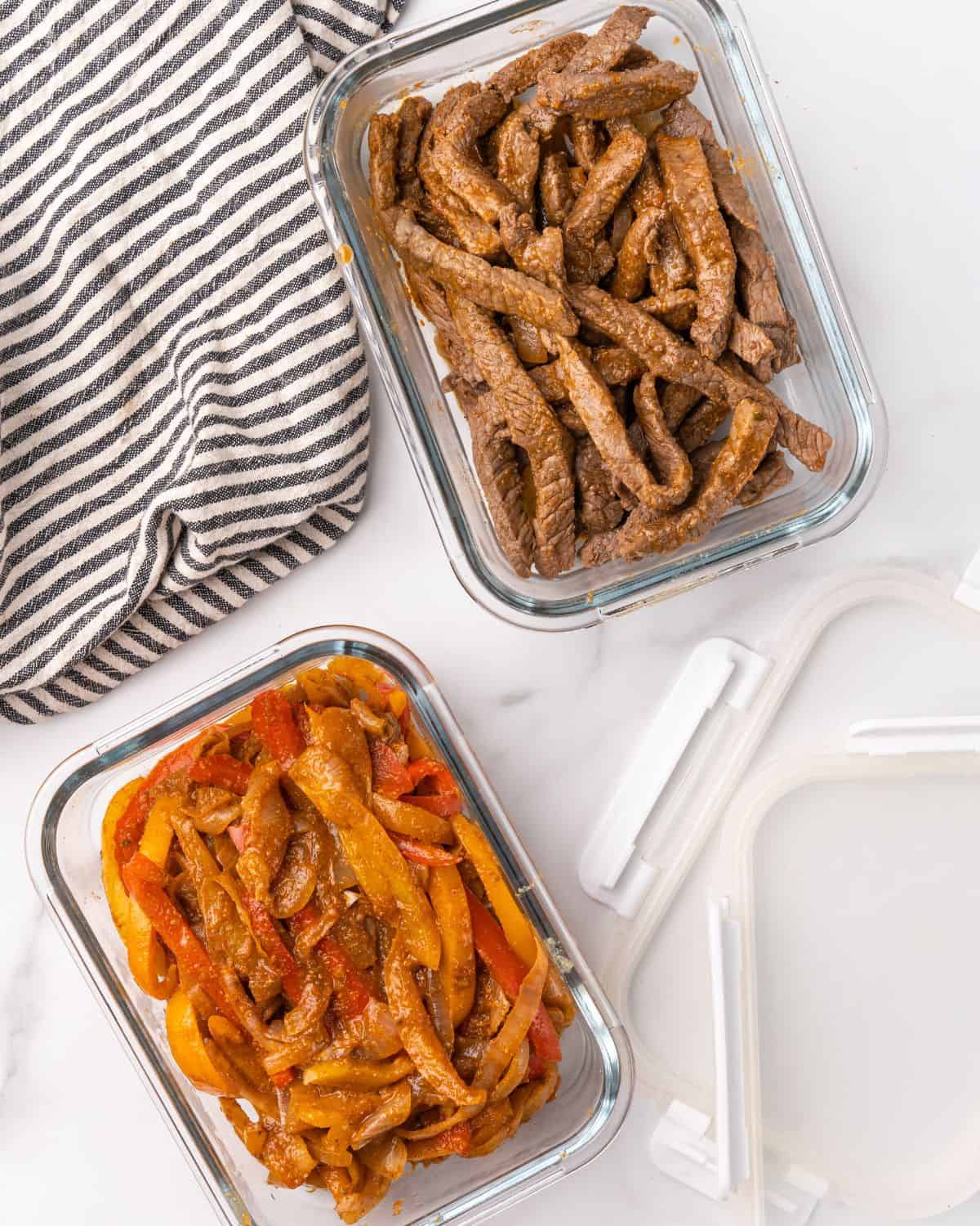 cooked steak fajita ingredients in a glass containers.