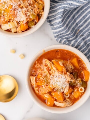 overhead of two bowls of chicken soup