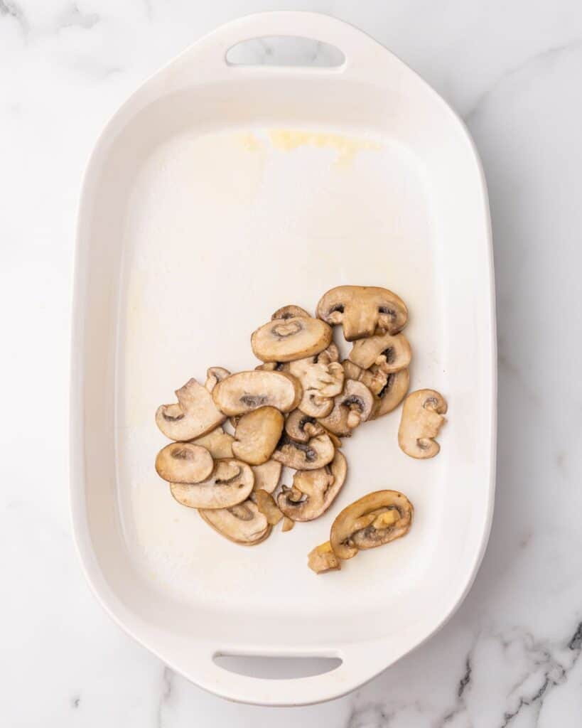 place mushrooms in the baking dish.