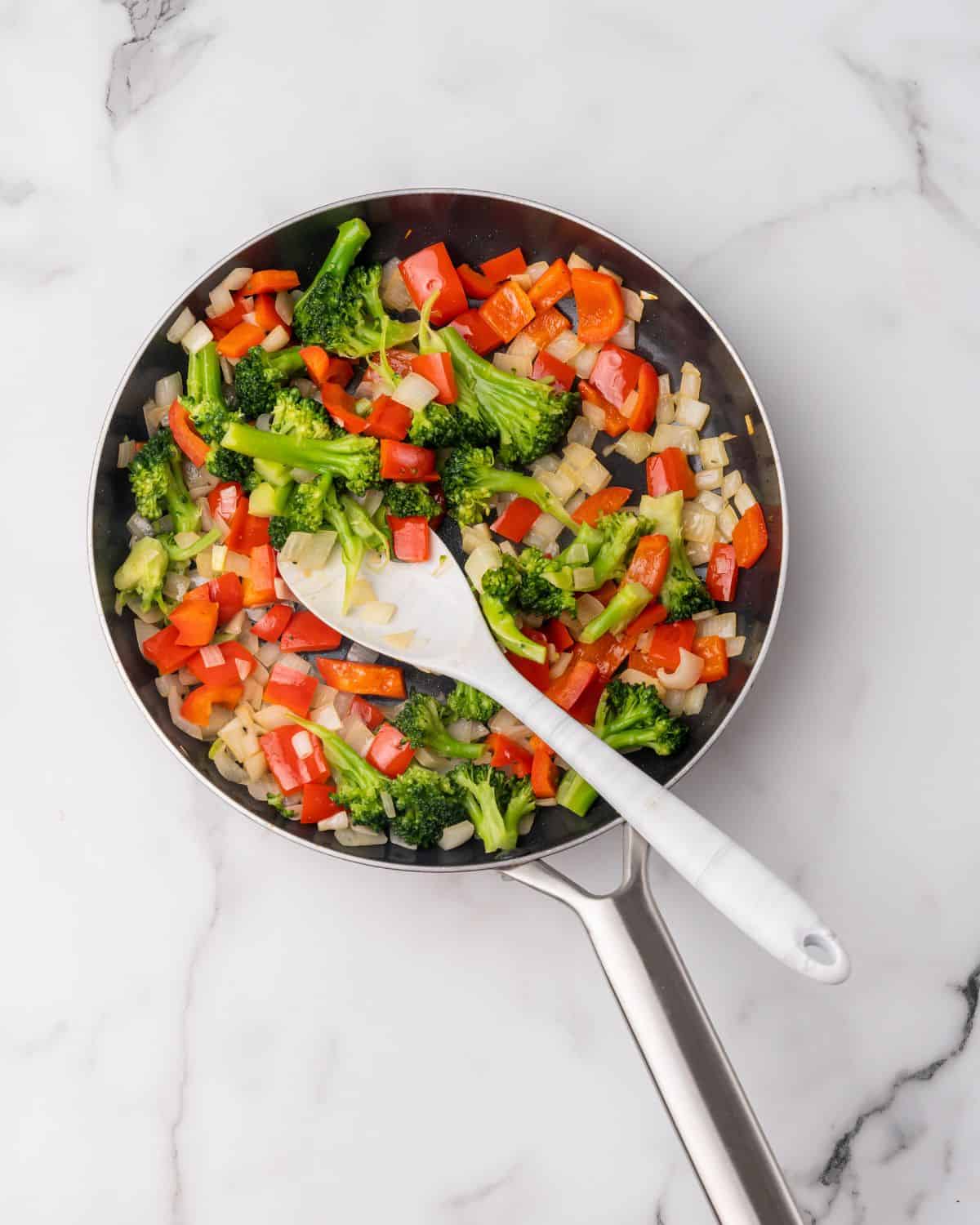 veggies cooking in a pan