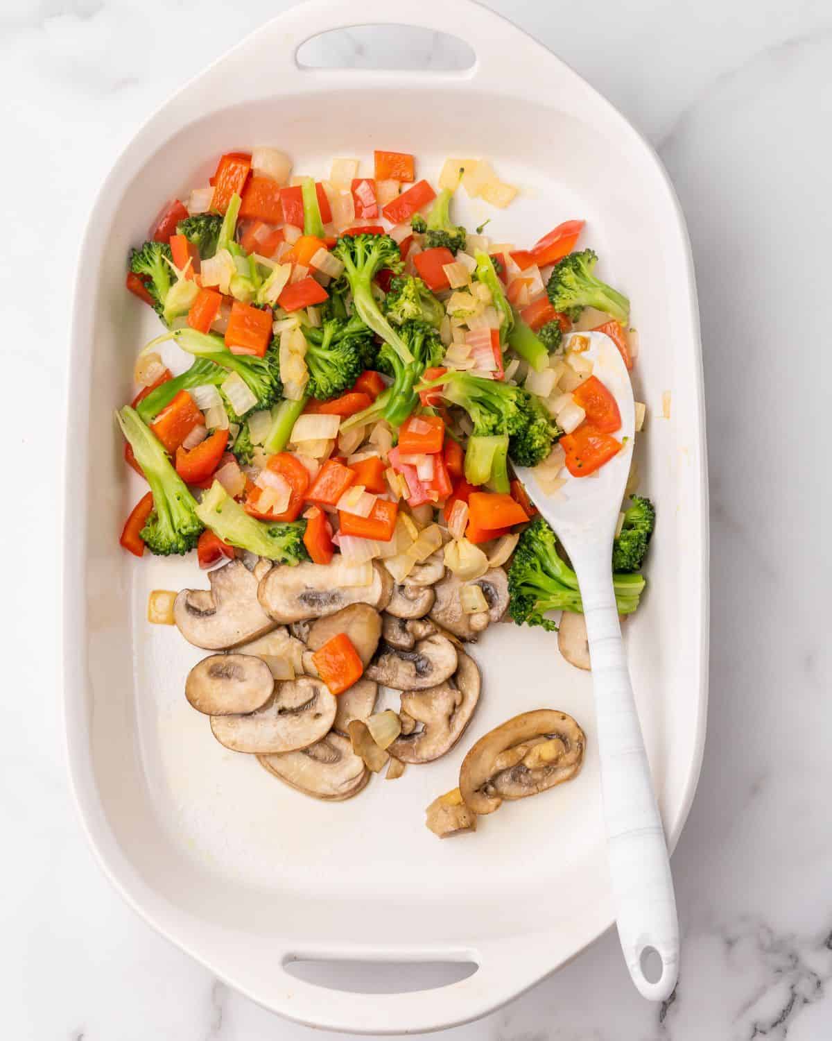 veggies and mushrooms in the baking dish.