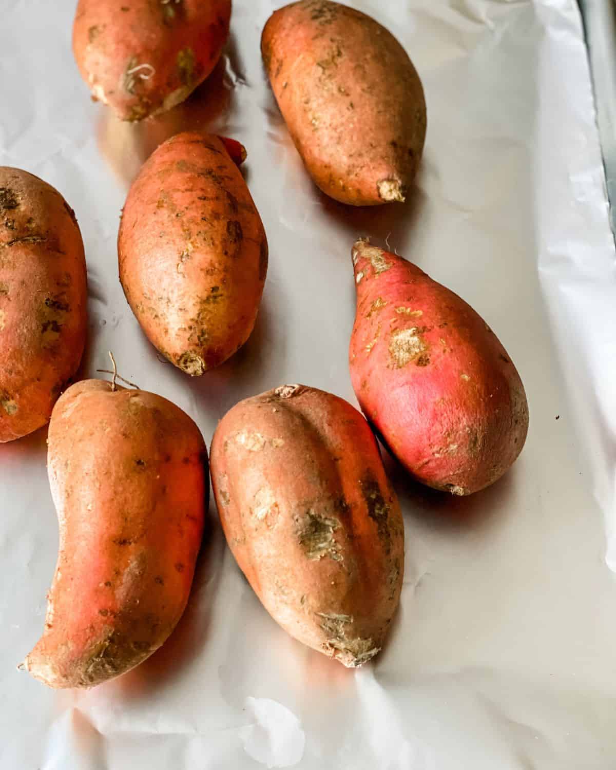 roasted sweet potatoes on a sheet pan.