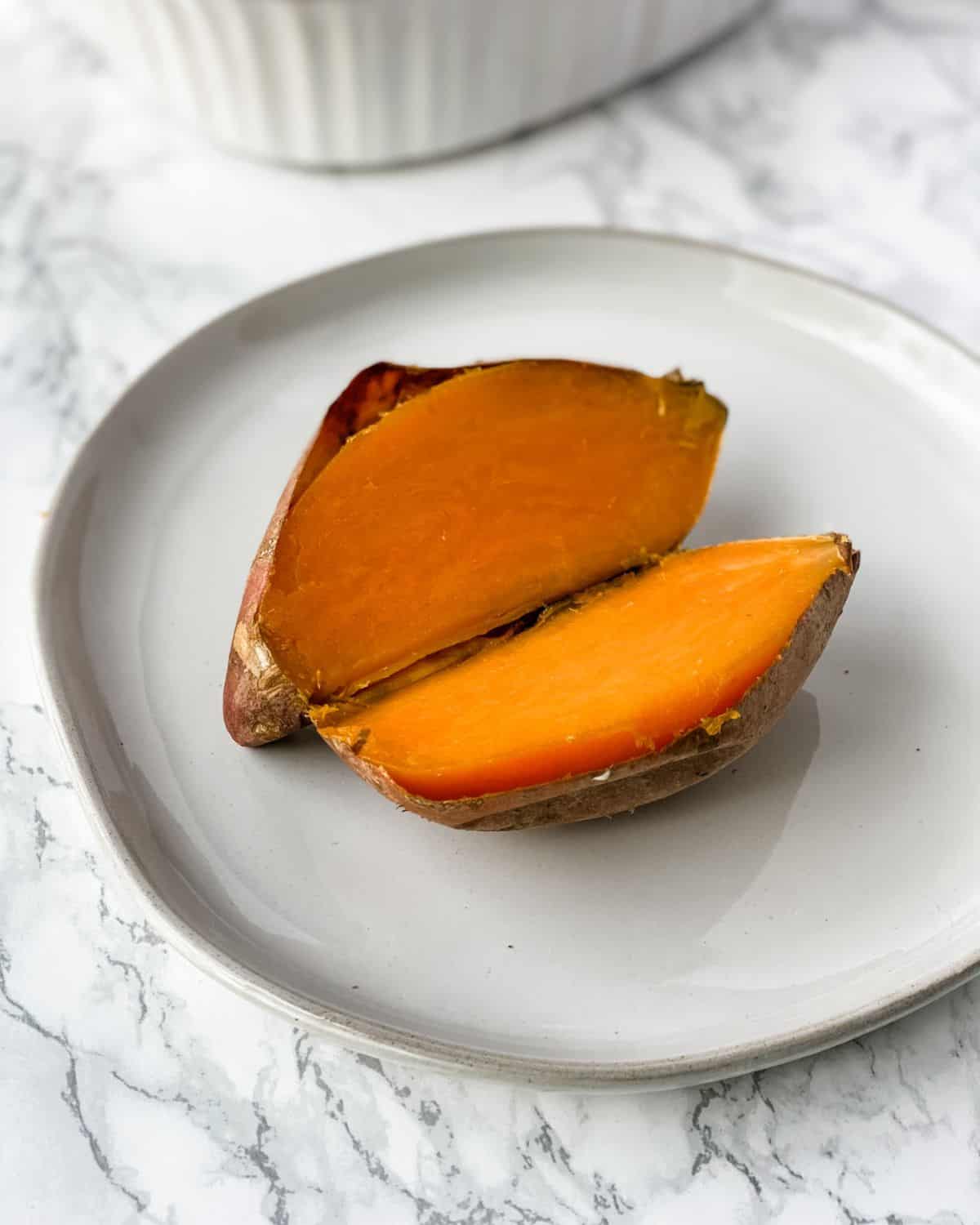 cooked sweet potatoes on a plate.
