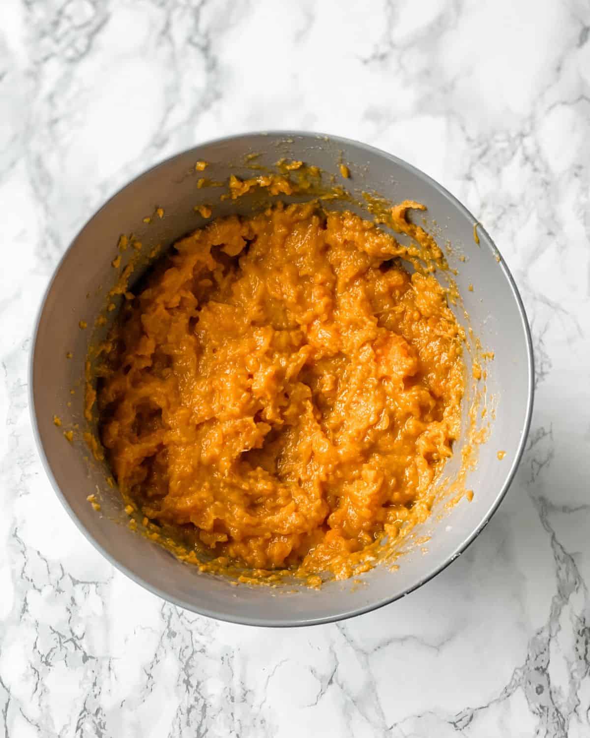 sweet potatoes mixed with the other ingredients in a bowl.