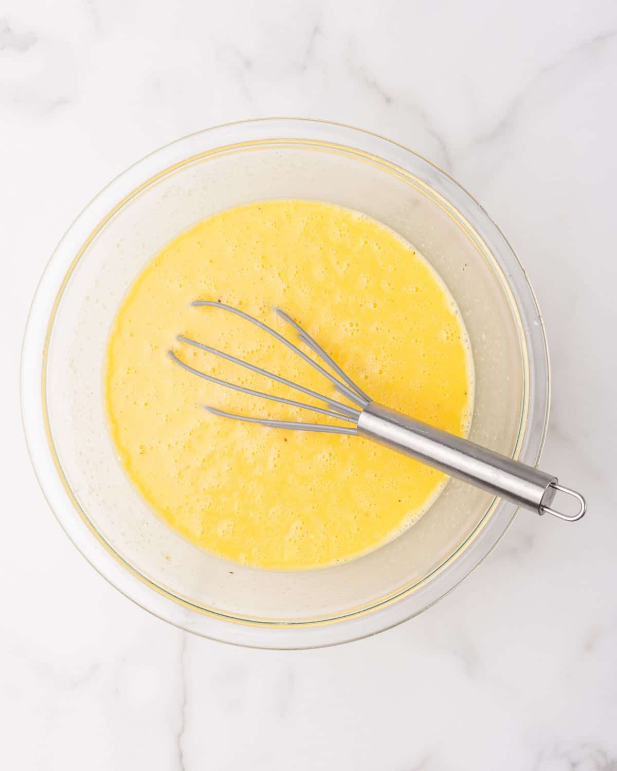 eggs mixed with the other ingredients in a bowl.