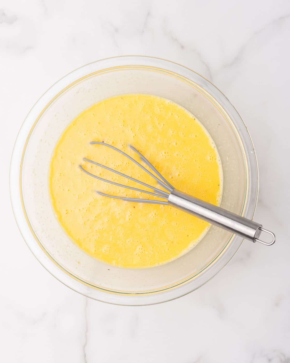 eggs mixed with the other ingredients in a bowl.