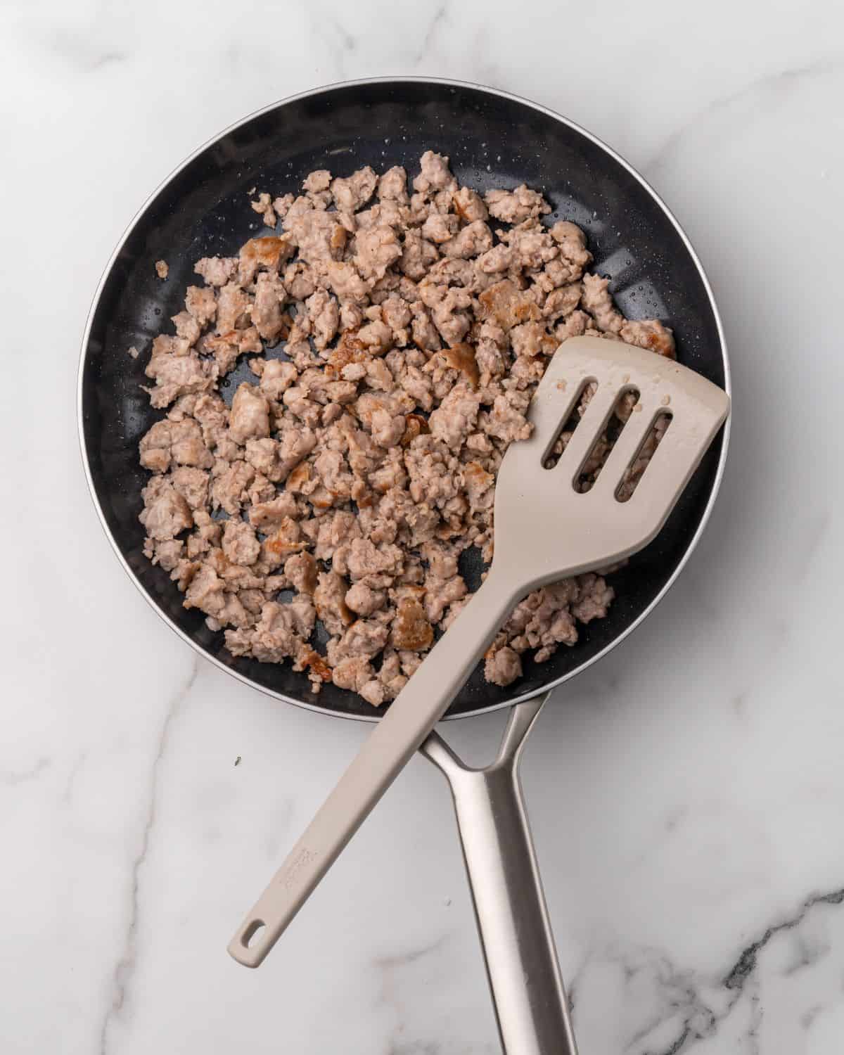 overhead picture of cooked breakfast sausage in a skillet.